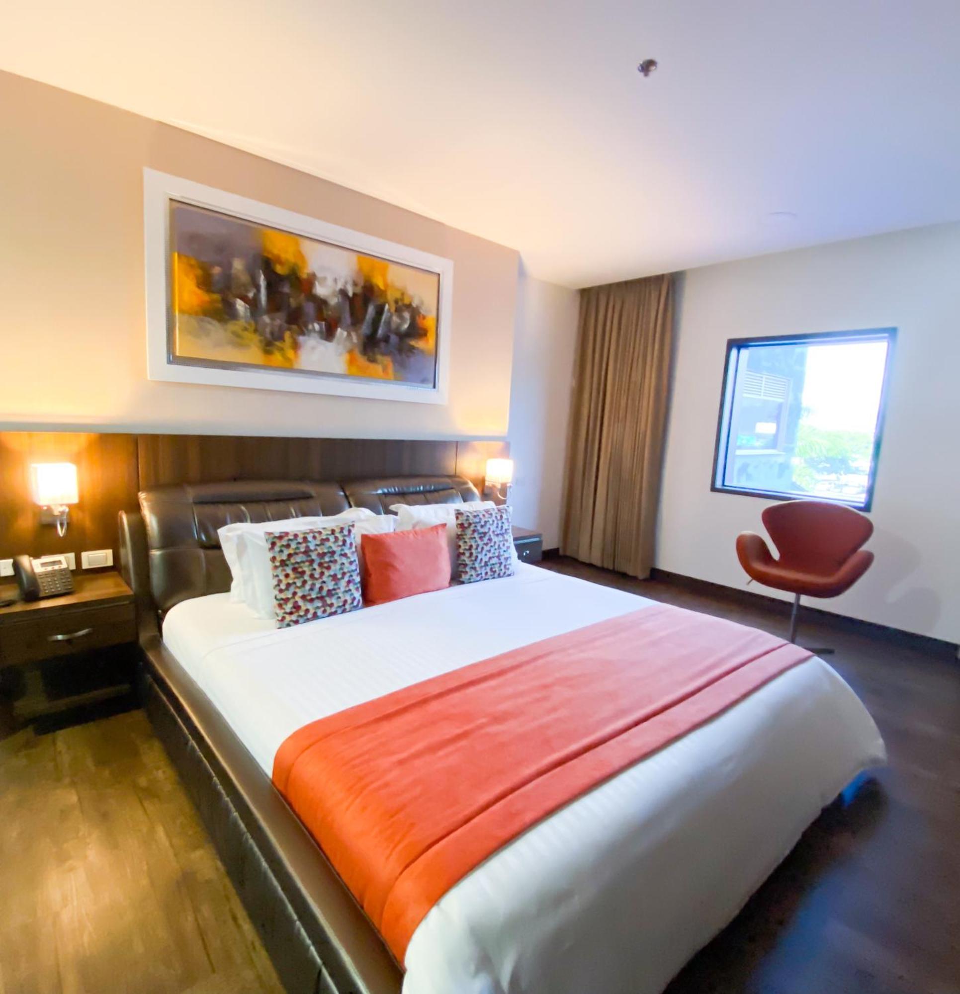 Hotel Royal Elim International Cali Exterior foto A bedroom at the hotel
