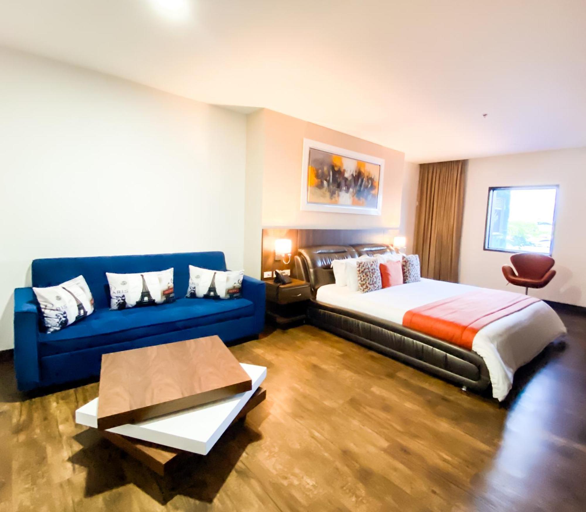 Hotel Royal Elim International Cali Exterior foto A room at the hotel