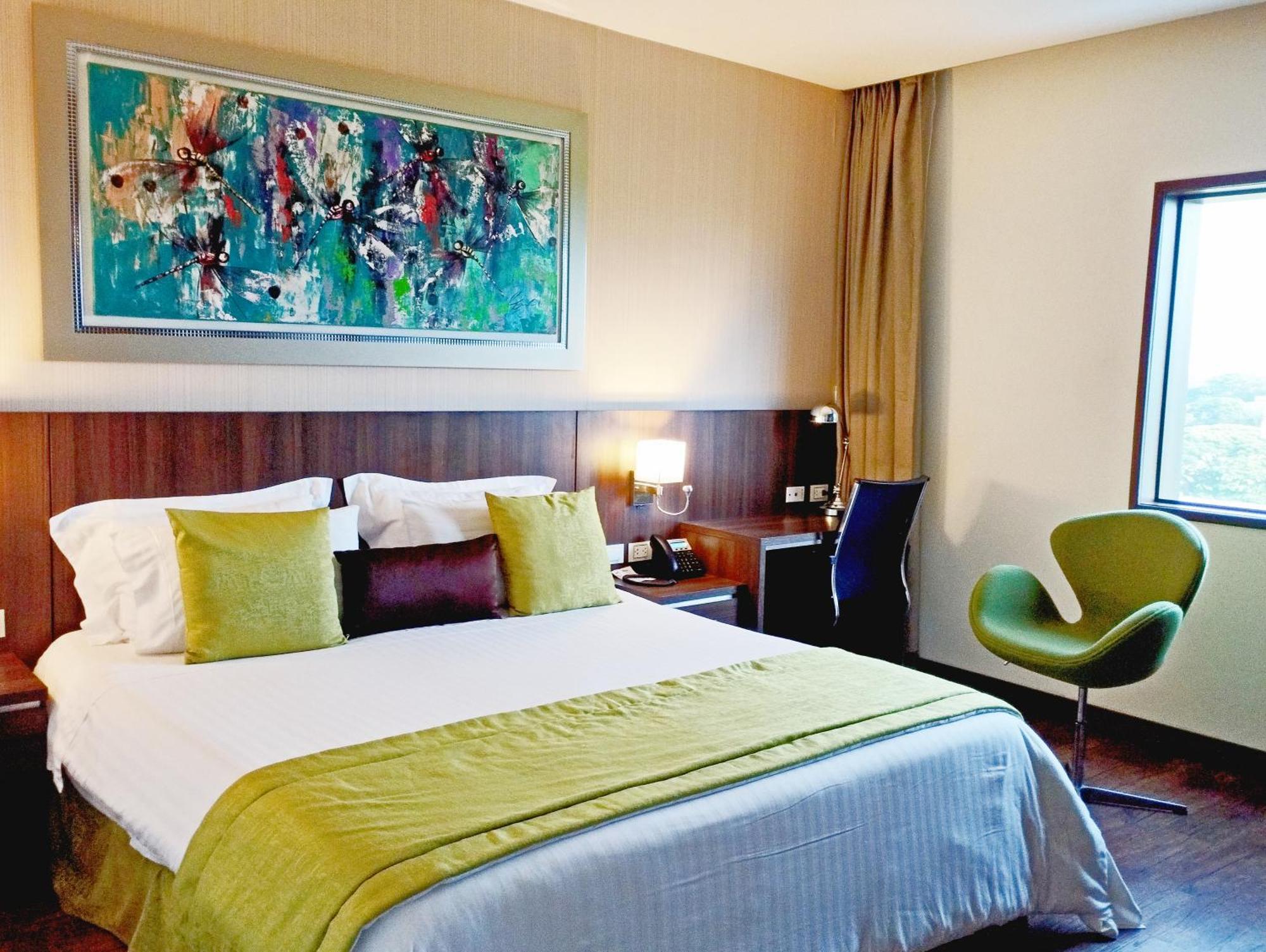 Hotel Royal Elim International Cali Exterior foto A room at the hotel