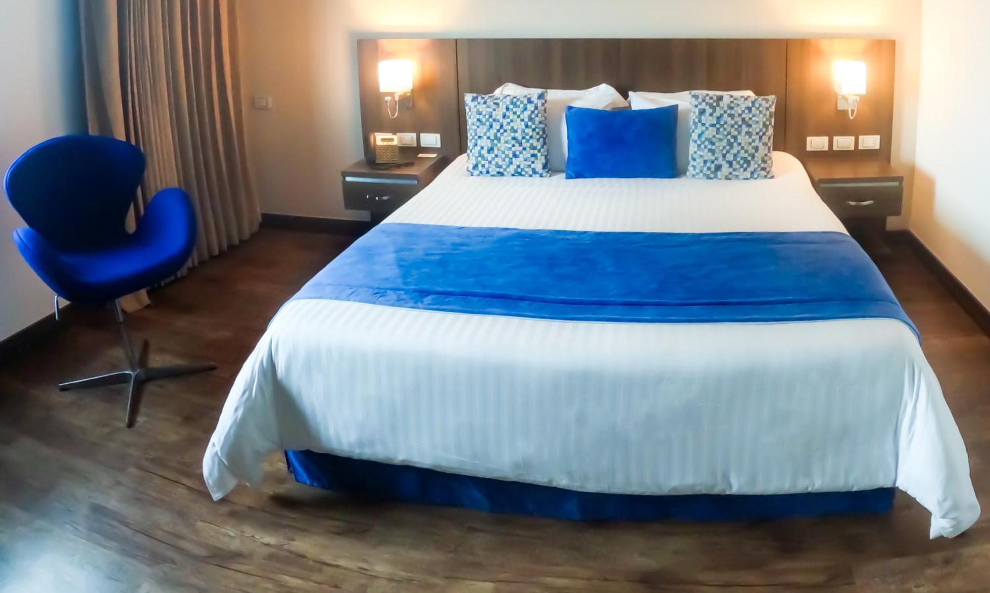 Hotel Royal Elim International Cali Exterior foto A bedroom at the hotel