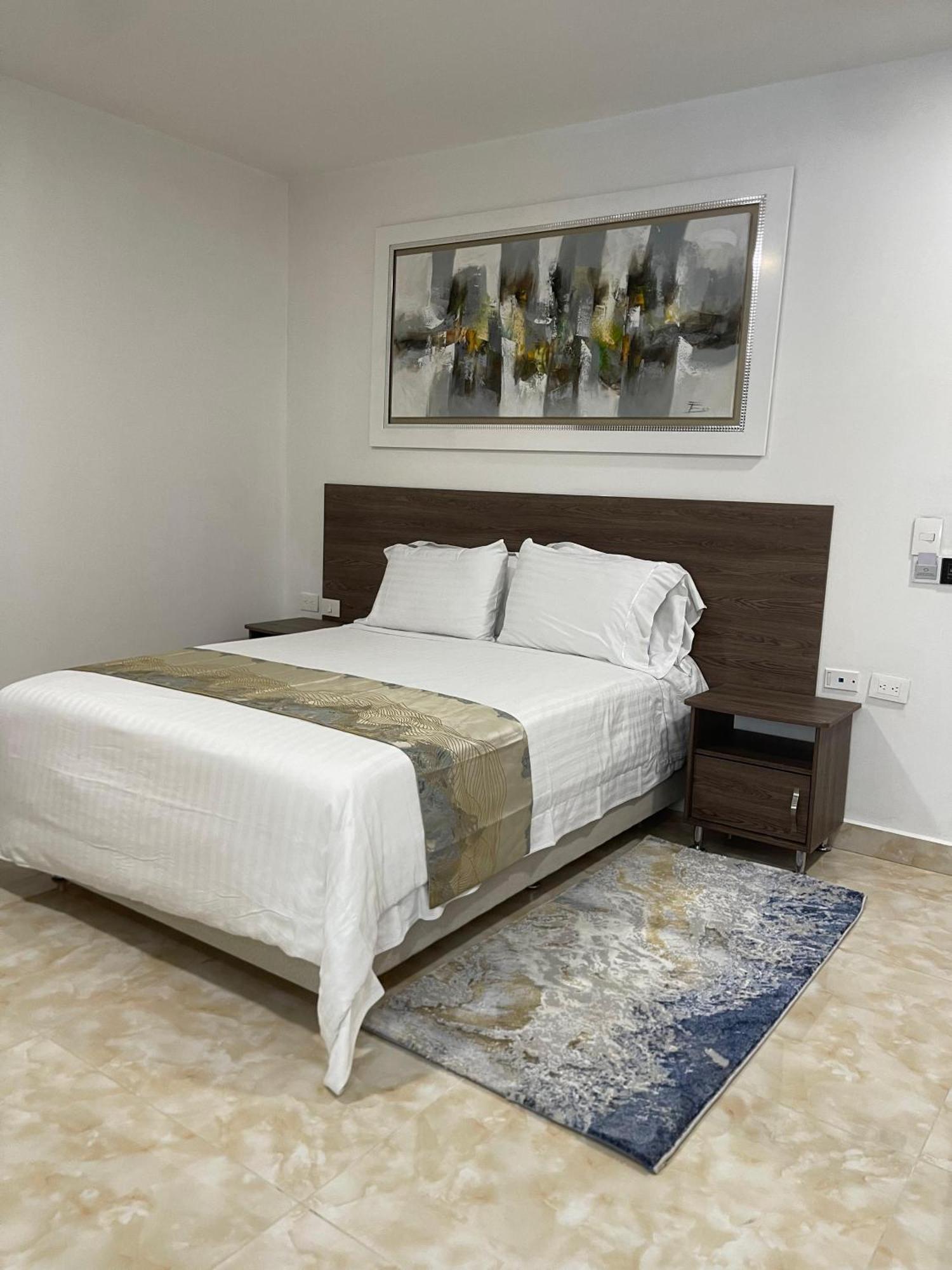 Hotel Royal Elim International Cali Exterior foto A bedroom at the hotel